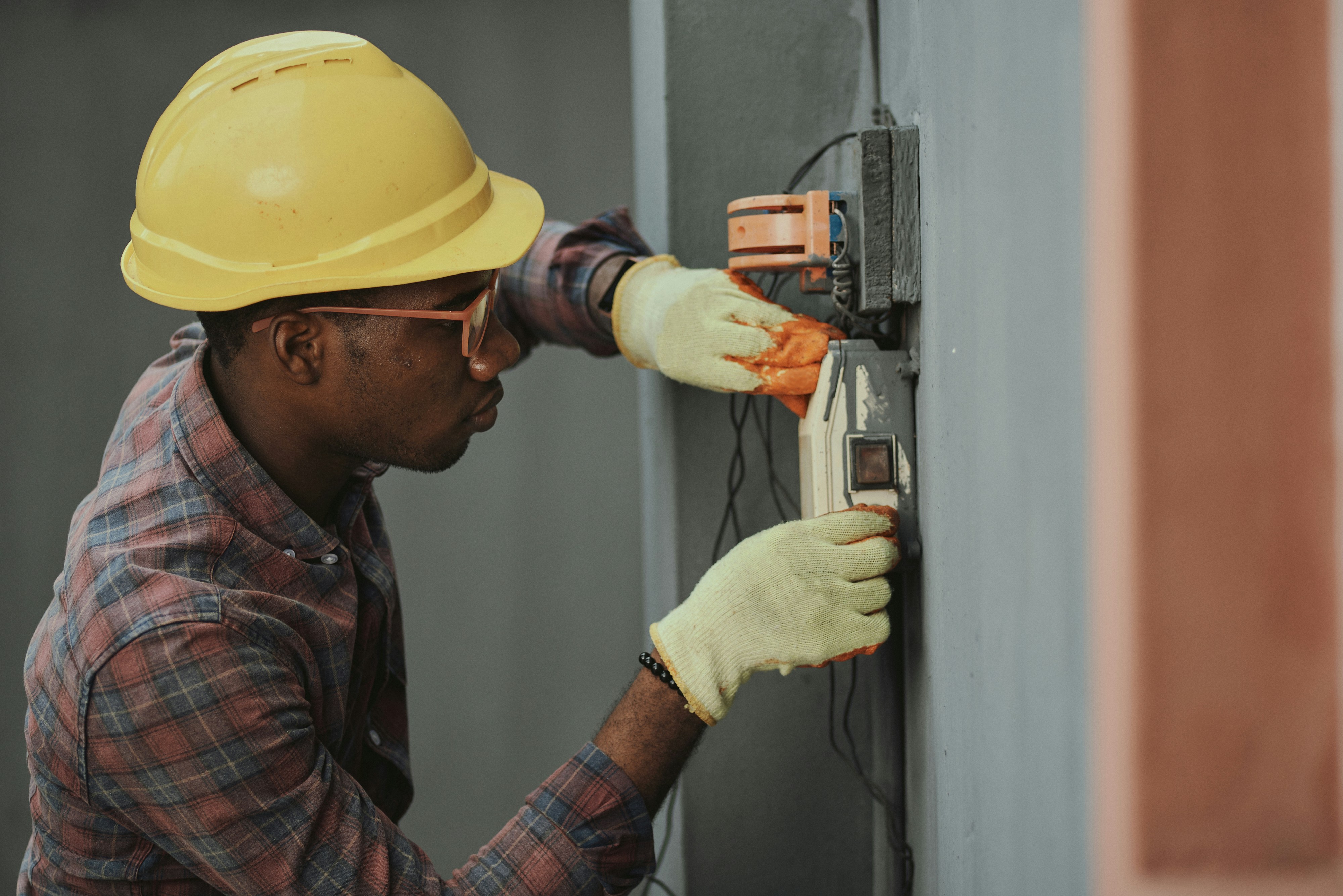 John, NICEIC registered electrician working on a panel